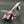 VINTAGE SUKHOI SU-27 FLANKER DESK CLOCK — MINIATURE SIZE — CHROMED & SATIN DIE-CAST METAL — CIRCA 1990–2010