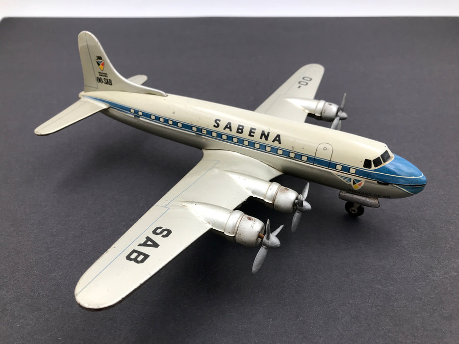 RARE - Modèle ARNOLD en tôle lithographiée d'un Douglas DC-6B de la Sabena (OO-SAB)